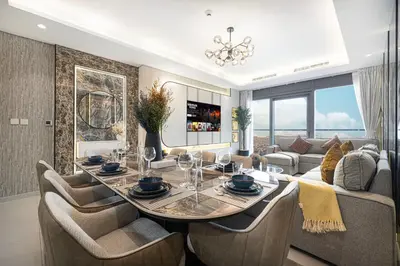 a dining room with a table and a couch at Dubai Scenic Infinity Pool with Burj Khalifa Views in Dubai