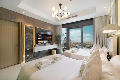 a bedroom with two beds and a large window at Dubai Scenic Infinity Pool with Burj Khalifa Views in Dubai