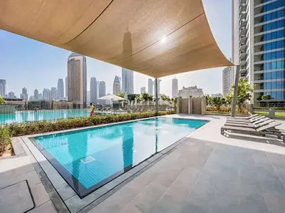 a swimming pool on the roof of a building at Dubai Mall Connection - Burj Views - Turf Balcony in Dubai