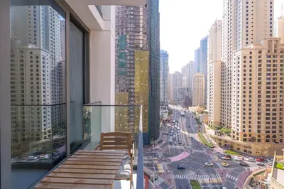 a balcony of a building with a view of a city at NEW Listing - Czechin - JBR Beach a Few Steps Away in Dubai