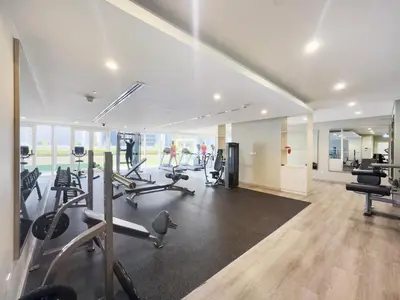 a gym with treadmills and cardio equipment in a building at Aliving Exclusive 1BR Reva Residence Business Bay-218 in Dubai