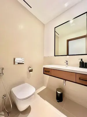 a bathroom with a toilet and a sink and a mirror at VIDA Residences Dubai Marina 1BR - Seaview, JBR, Dubai Eye in Dubai