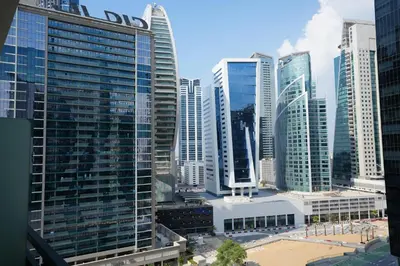 a view of a city with tall buildings at Cozy Flat in Business Bay in Dubai