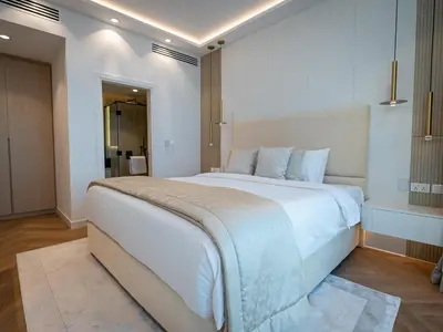 a bedroom with a large white bed in a room at Daniels Sea View 2BR in Oceana The Palm Jumeirah in Dubai