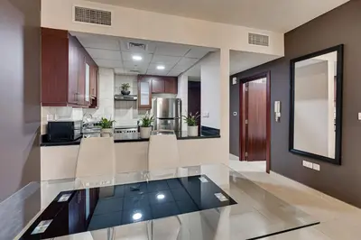 a large kitchen with a glass counter top at Studio sea view in Dubai