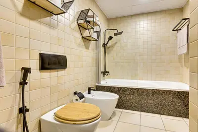 a bathroom with a toilet and a bath tub at Studio sea view in Dubai