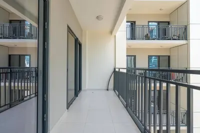 an empty corridor of a building with balconies at The View 1 Bedroom in Dubai