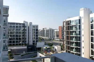 an aerial view of a city with tall buildings at Nice Studio in Azizi Riviera 32 - Dubai in Dubai