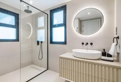 a bathroom with a sink and a mirror at Stunning Palm Villa with Rooftop Garden, Resort Style Pool and Beach by Exclusive Holiday Homes in Dubai