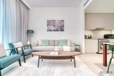 a living room with a couch and a table at Capacious 2BR at Sunset at Creek Beach 3 Dubai Creek Harbor by Deluxe Holiday Homes in Dubai