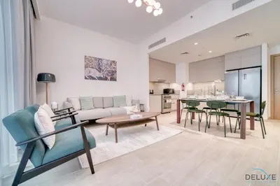 a living room with a couch and a table at Capacious 2BR at Sunset at Creek Beach 3 Dubai Creek Harbor by Deluxe Holiday Homes in Dubai