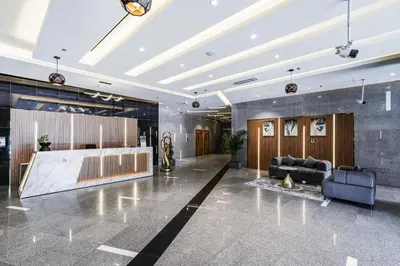 a lobby with a couch and a table at Studio close to Burj Khalifa and Downtown Dubai in Dubai
