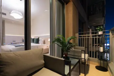 a living room with a couch and a bedroom at Burj Khalifa Views / 5 min walk from Dubai Mall / Dubai Opera / Upgraded / Designer Choice / 8 people / The Best Location in Dubai