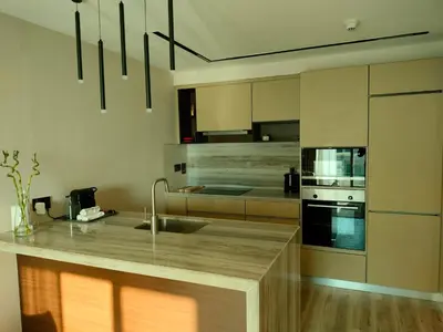 a kitchen with a sink and a counter top at Modern-Chic 1BR in The Greens - Central Dubai in Dubai