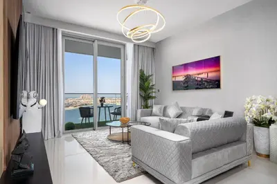 a living room with a couch and a table at *Private Beach* Best Ocean View Emaar BeachFront in Dubai