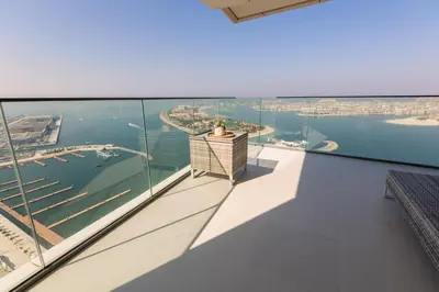 a view of the harbor from the balcony of a house at Emaar Beachfront Beach Vista 3bdr apartment in Dubai