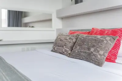 two pillows sitting on top of a bed at Guestready - Grey Pearl with Big Balcony in Dubai