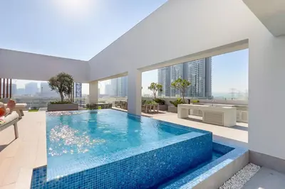 a swimming pool in a house with a view of a building at Guestready - Grey Pearl with Big Balcony in Dubai