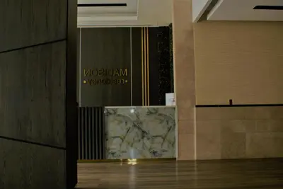 a lobby with a sign on the wall of a building at Studio Apartment - Cozy, Very Accessible and so near to Train Station in Dubai