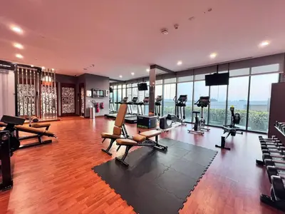 a gym with treadmills and exercise equipment in a building at Lux Golf Views 3 BR in Emirates Hills in Dubai