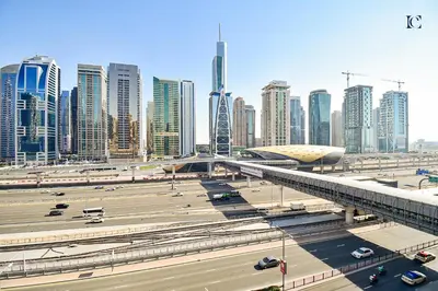 a city with tall buildings and a highway with cars at Luxury Escapes - Stylish 1BR Apartment - Close to Metro in Dubai Marina - Cascade Tower in Dubai