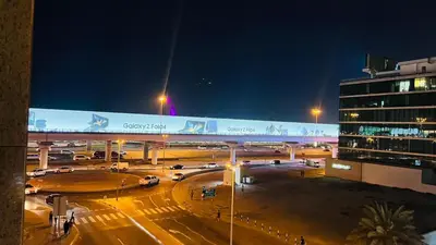 a view of a parking lot at night at Arch Partition Room Near Mall of the Emirates in Dubai
