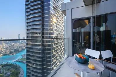 a balcony of a building with a bowl of fruit on it at Stunning Full Burj Khalifa View - The Address 2BR Luxury in Dubai