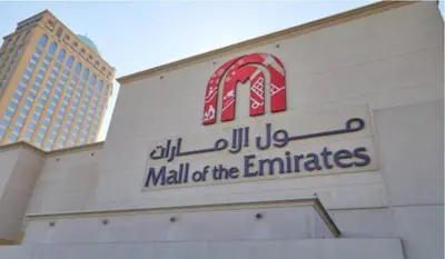 a mall of the emirates sign on a building at Epic Partition Room in Barsha Near Metro in Dubai