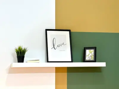 a picture frame sitting on a shelf in a room at Budget Double Partition Room in Barsha Heights Near Metro in Dubai