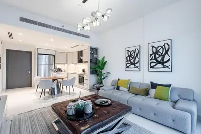 a living room with a couch and a table at Seaside Serenity Perfect Beachfront Holiday Haven in Dubai