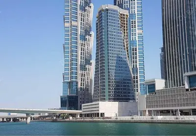 a view of a large city with tall buildings at Deluxe Apartment With Panoramic View Near Metro in Dubai