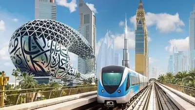 a blue and white train on the tracks in a city at Fashion Partition Room Near Mall of The Emirates in Dubai