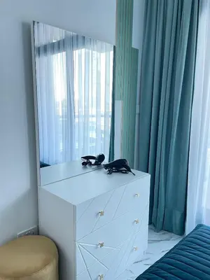 a white dresser with a mirror on top of it at Stay in heart of Dubai Marina Residence B walk to the JBR in Dubai