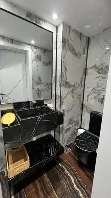 a bathroom with a black sink and a mirror at Stay in heart of Dubai Marina Residence B walk to the JBR in Dubai