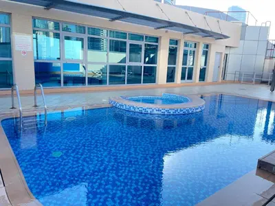 a large swimming pool in front of a building at Stay in heart of Dubai Marina Residence B walk to the JBR in Dubai