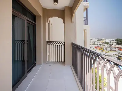 a balcony of a building with a view of a city at Brand new 2 Bedroom apartment in Madinat Jumeirah Living in Dubai