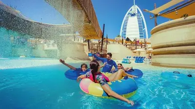 a group of people in the water at a resort at New 2 bedroom entire apartment in Madinat Jumeirah Living in Dubai