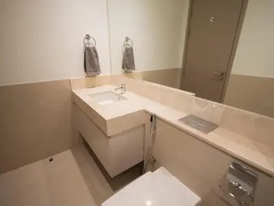 a bathroom with a sink and a mirror at MH - Act One Act Two - 2BHK - REF503 in Dubai