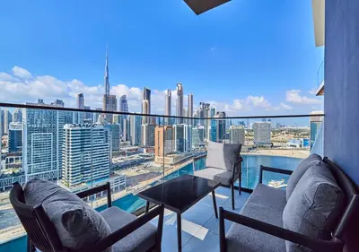 a balcony with chairs and a view of a city at Lux Studio in Business Bay -10 mins to Burj Khalifa - Binghatti Canal in Dubai
