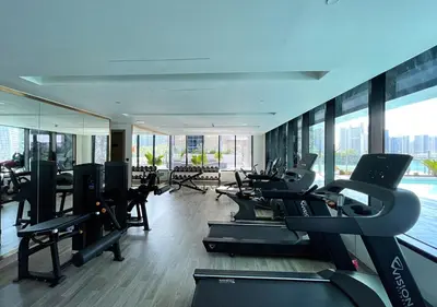 a gym with treadmills and cardio equipment in a building at Lux Studio in Business Bay -10 mins to Burj Khalifa - Binghatti Canal in Dubai