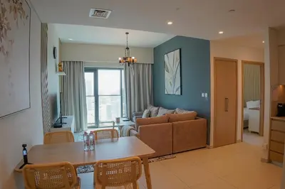 a living room with a couch and a table at Beautiful apartment by Dubai Mall 161BR-2 in Dubai