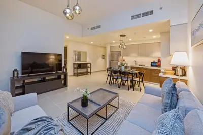 a living room with a couch and a table at 2-Bedroom in the Heart of Downtown Dubai in Dubai