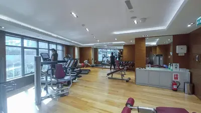 a gym with treadmills and exercise equipment in a building at Stylish Stayz beautiful modern apartment with Burj Khalifa views in Dubai