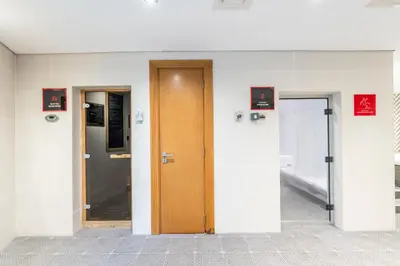 a hallway with two doors in a building at Stylish Stayz beautiful modern apartment with Burj Khalifa views in Dubai