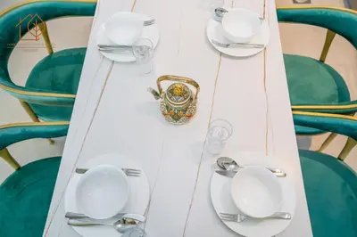 a table with plates and utensils on it at Amazing One Bedroom Apartment in Downtown Dubai 167FO2-1 in Dubai