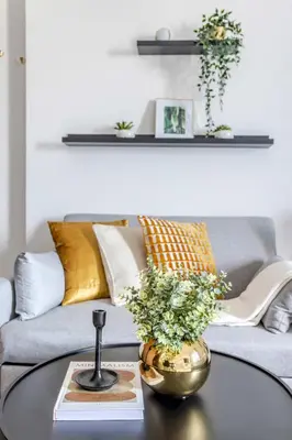 a living room with a coffee table with a couch at Frank Porter - Elite 5 Sports Residence in Dubai