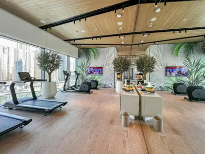a gym with treadmills and exercise equipment in a building at NEW Luxe 3BR in Vida Marina w/ Breathtaking Views in Dubai