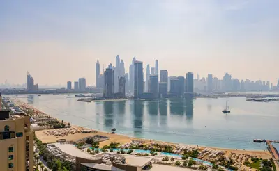a view of a city with a large body of water at Luxury Studio, Seven Palm Residence-Palm Jumeirah in Dubai