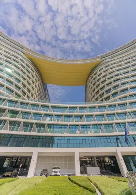 a large building with a lot of windows at Luxury Studio, Seven Palm Residence-Palm Jumeirah in Dubai