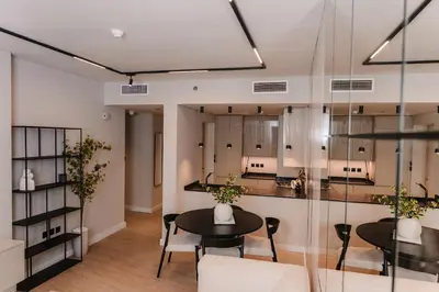 a dining room with a table and chairs at Modern Fully-Equipped Apartment in Seven Palm, Beach and Pool Access in Dubai